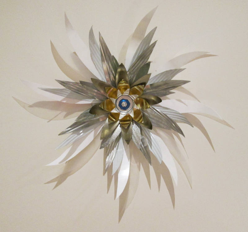 ‘olearia’, bolts, hook, re-purposed tin, plastic, aluminium 35 cm diameter, 2015