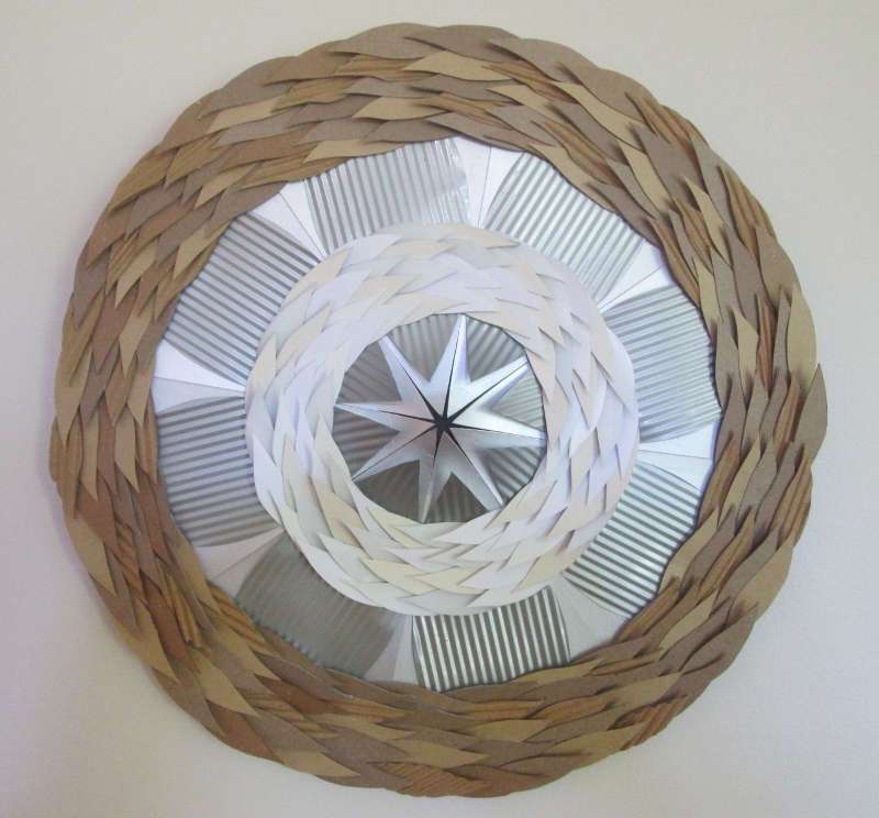 ‘leaf mandala 1’, staples, re-purposed hardboard, tin, plastic, cardboard 35 cm diameter, 2015