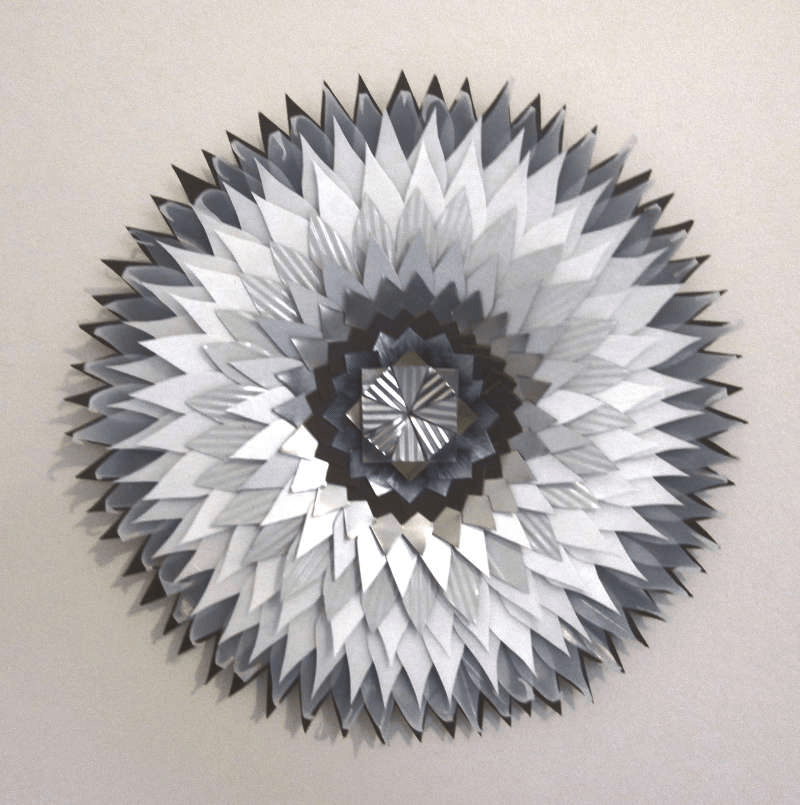 ‘leaf mandala 4’, staples, glue, re-purposed hardboard, tin, plastic, cardboard, aluminium, 35 cm diameter, 2015